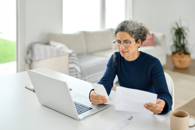 Woman checking her personal injury settlement